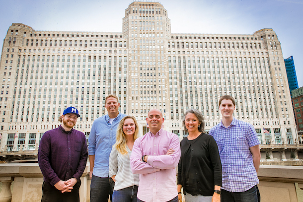 Black spectacles team in front of a building